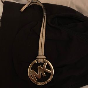 MK logo and leather strap!